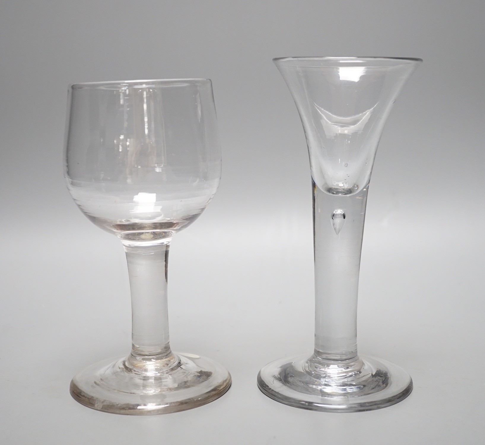 A mid 18th century mead glass and a similar drawn trumpet ale glass, tallest 17cm